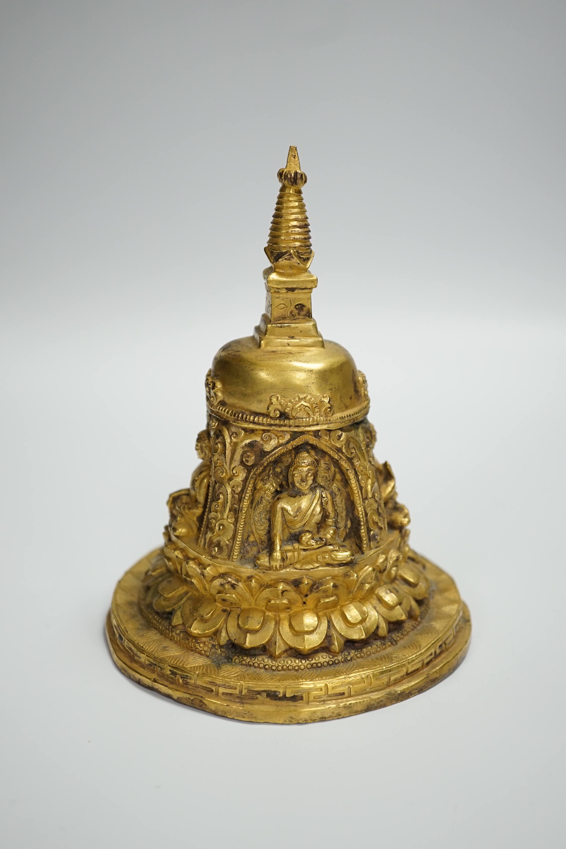 A Sino-Tibetan gilt bronze model of a stupa, 16cm high